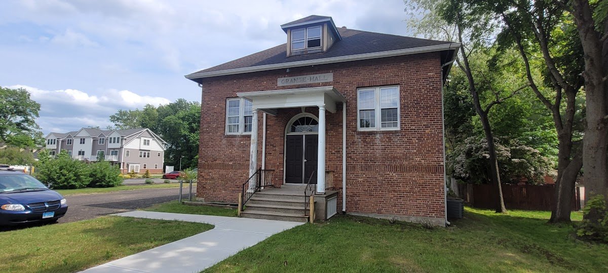 Glastonbury Theater — Historic brick building exterior at 43 Naubuc Avenue
